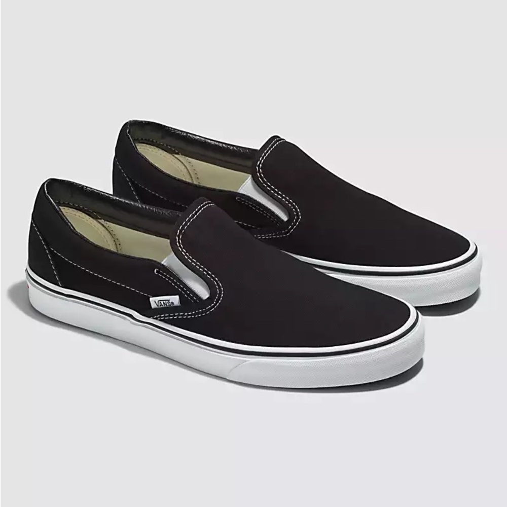 Vans black and white slip ons